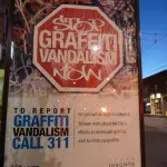 CA Toronto report graffiti poster ad