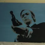 stoop CA holding gun