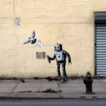 Banksy NYC 2013 Coney Island robot tagger