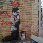 Banksy UT Sundance praying vandal