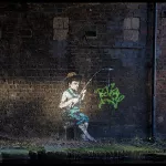 Banksy boy fishing