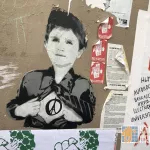 FR Paris Belleville child superman paste up