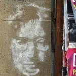 DE Berlin man with glasses on brick