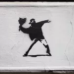 DE Hamburg Banksy Spoof throwing flowers