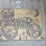 Michael Roman skeleton on bike