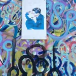 SF Richmond Dist kissing couple on wood