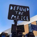 IL Chicago Defund the Police protest sign