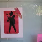 MN figure with arm raised