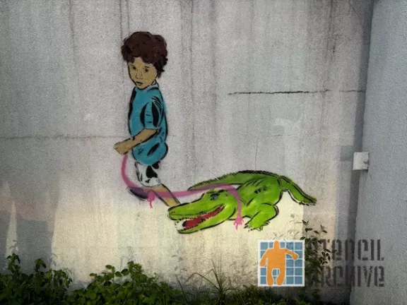 Josh Wingerter Garden Dist NOLA child with gator