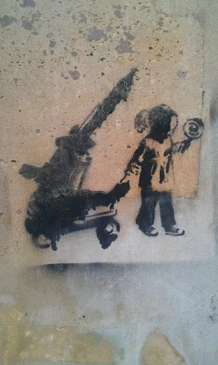 BE Brussels kid with missile in wagon