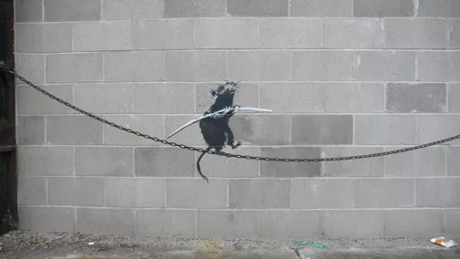 Banksy Detroit MI rat on a wire
