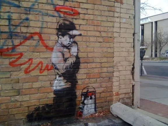 Banksy UT Sundance praying vandal