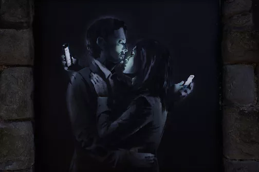 Banksy Cell phone love