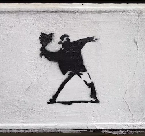 DE Hamburg Banksy Spoof throwing flowers