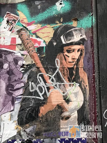 UK London Brick Ln female with bat on paper