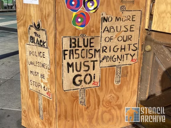 Jeremy Novy police protest signs wheatpastes