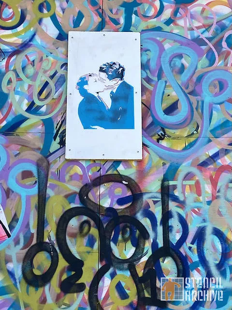 SF Richmond Dist kissing couple on wood