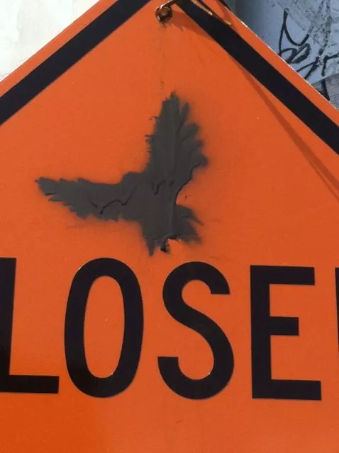 CA East Bay Oakland bird on sign