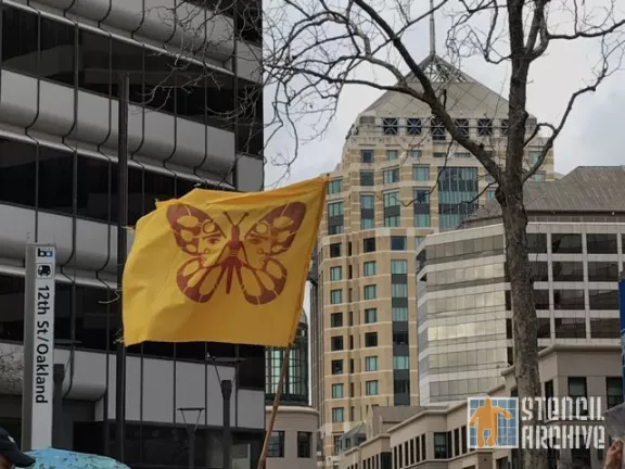 East Bay protest butterfly migrant flag