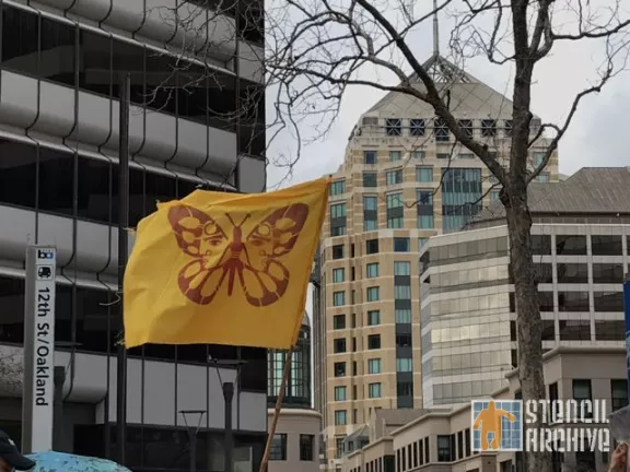 CA East Bay Oakland protest butterfly migrant flag